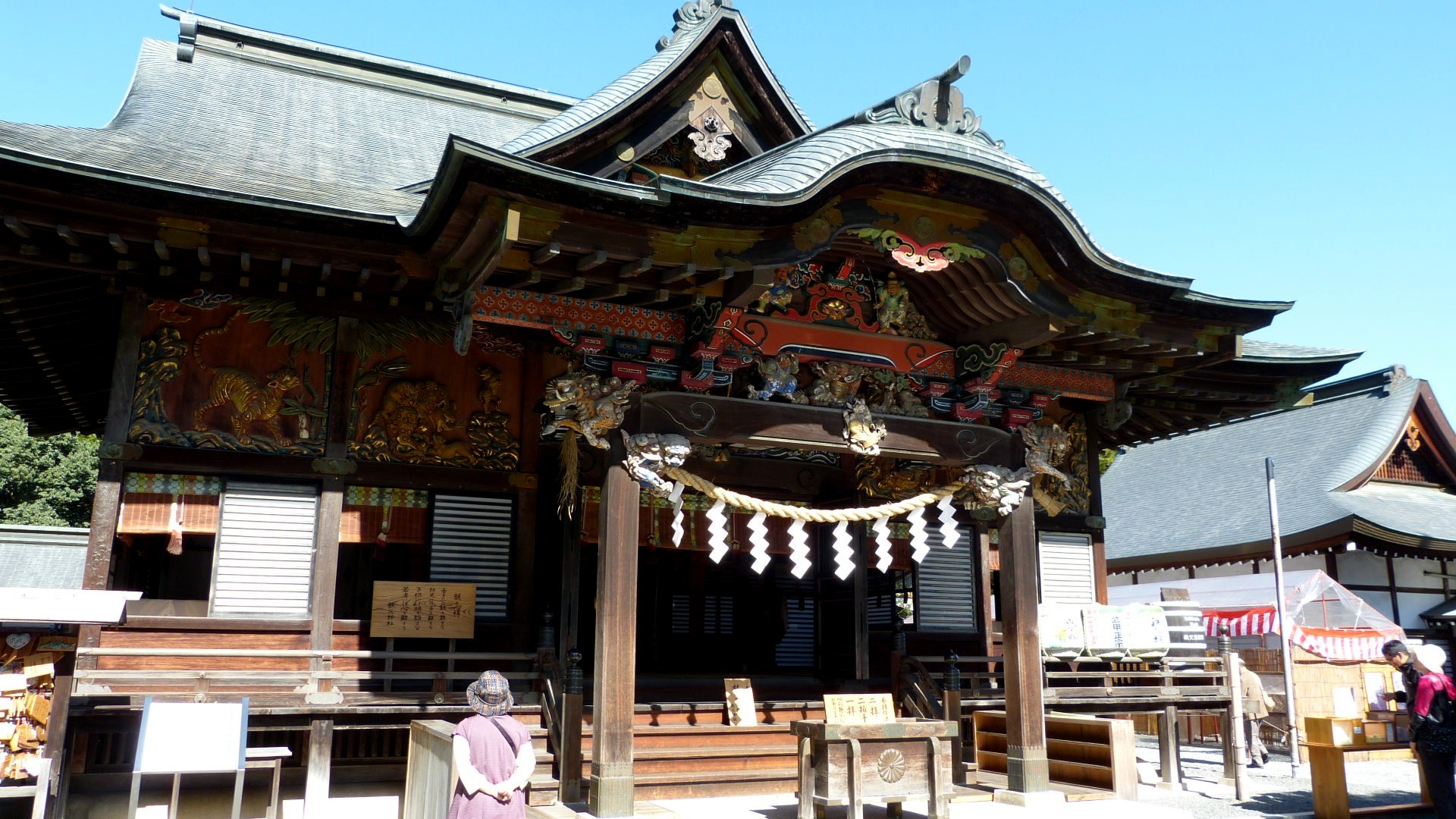 main wooden building with ornate wooden roof